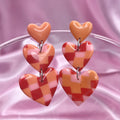 Handmade tiered heart clay earrings