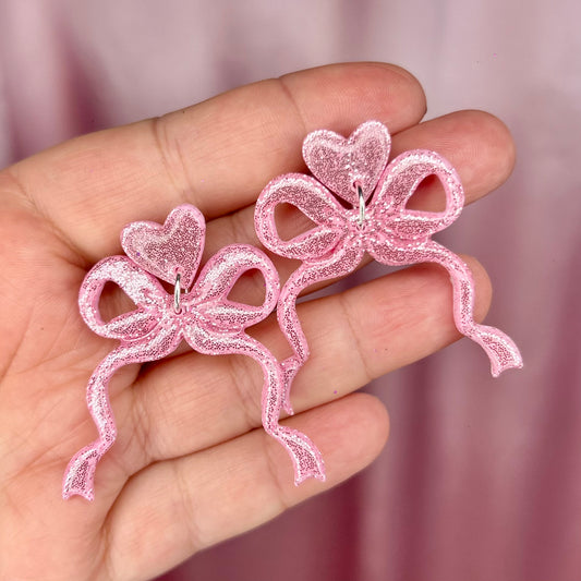 Handmade sparkly bow clay earrings