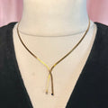 15.5” Gold toned lariat style necklace